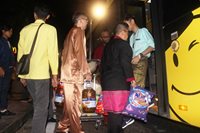 Staff of Hotel Granada assist in loading the necessities into the chartered bus